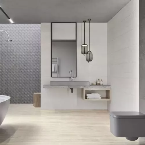 Nowoczesna łazienka z płytkami ściennymi Paradyż Minimal Stone Grys w jasnym, eleganckim wykończeniu.